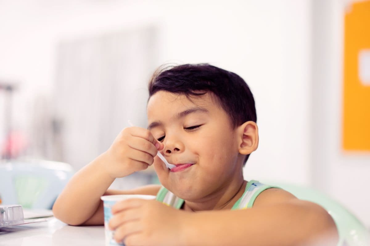 Child eating yogurt