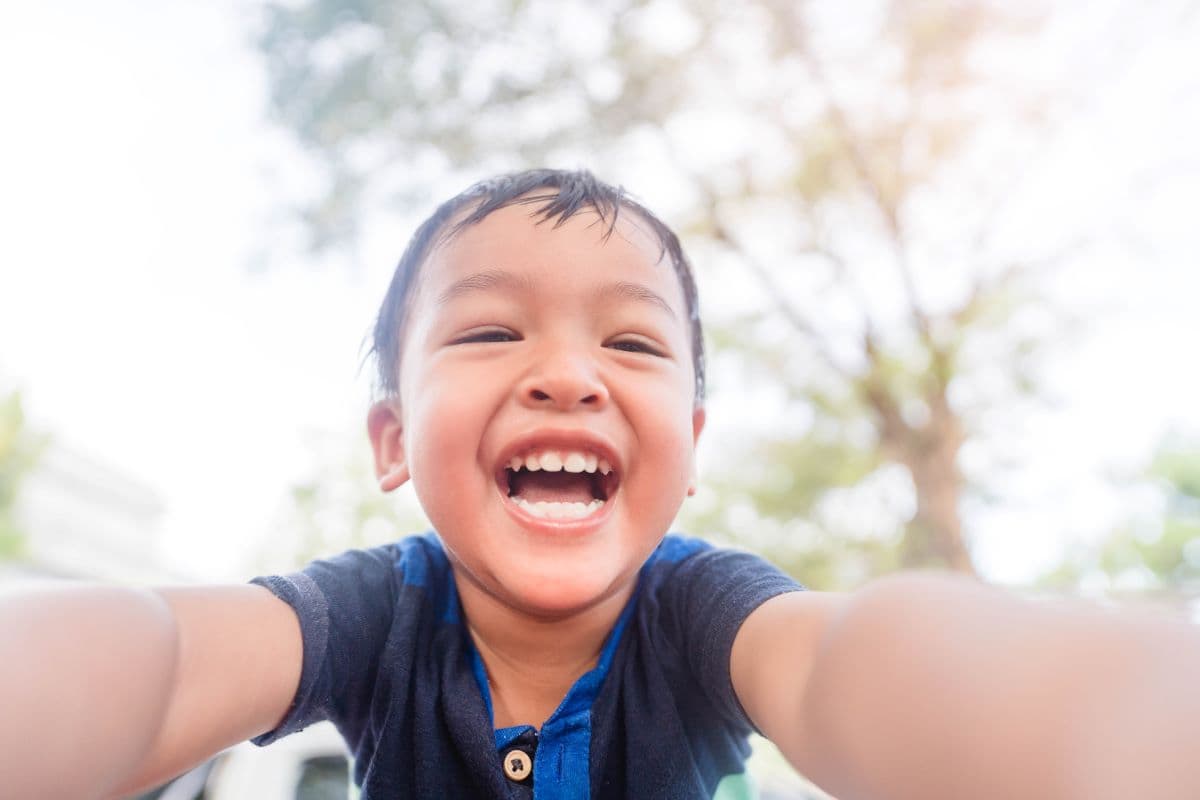 Child spinning with joy